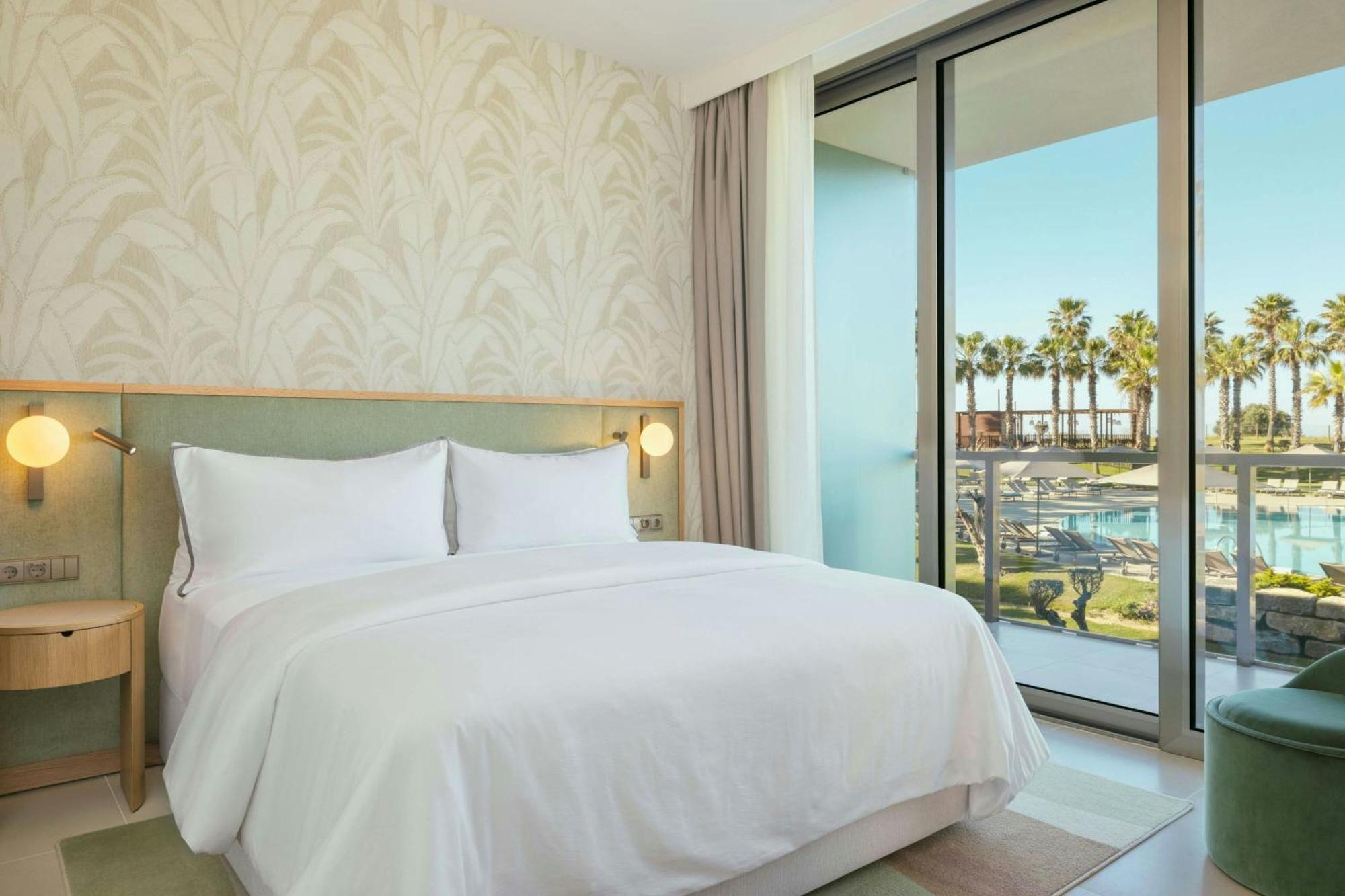Junior King Suite with Balcony and Pool View